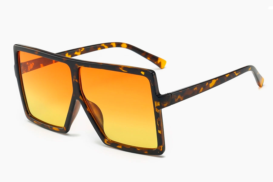 Oversized firkantet brille med orange-gule glas i fladt design